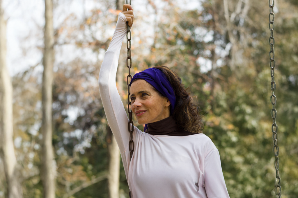 woman swinging and smiling